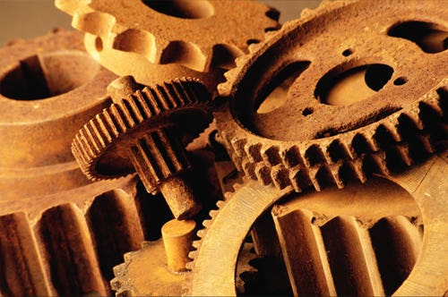Reddish colored wheels in an assembly machine