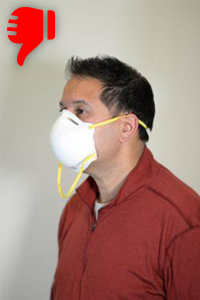 Image of worker wearing dust mask respirator incorrectly